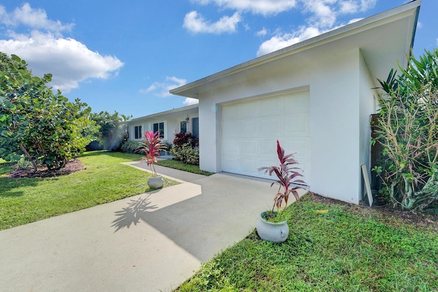 524 Lighthouse Dr, North Palm Beach, FL 33408 - single story home featuring driveway, stucco siding, a front lawn, and an attached garage