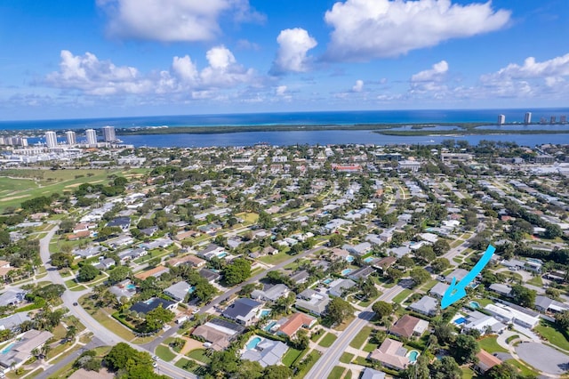 birds eye view of property with a water view