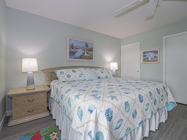 bedroom featuring dark wood-type flooring and ceiling fan