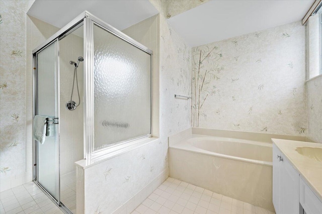 bathroom featuring vanity, independent shower and bath, and tile patterned floors