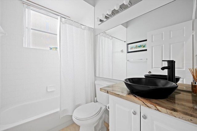 full bathroom featuring toilet, vanity, and shower / bath combo with shower curtain