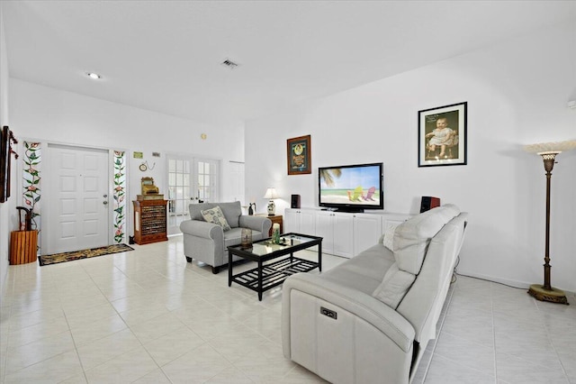 tiled living room featuring french doors