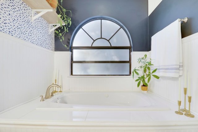 bathroom featuring tiled bath