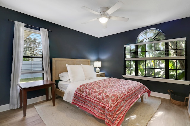 bedroom featuring hardwood / wood-style flooring and ceiling fan