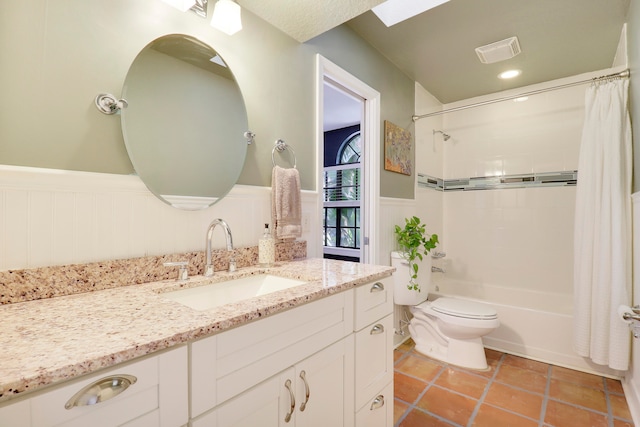 full bathroom with toilet, shower / tub combo, vanity, and tile patterned floors