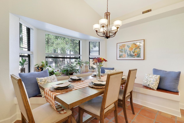 dining space featuring a chandelier, light tile patterned floors, and a healthy amount of sunlight