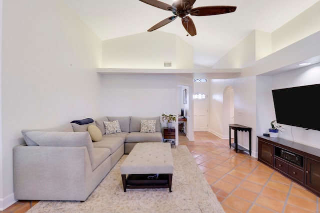 living room with vaulted ceiling, light tile patterned floors, and ceiling fan