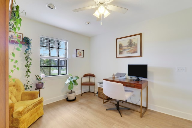 office space with light wood-type flooring and ceiling fan