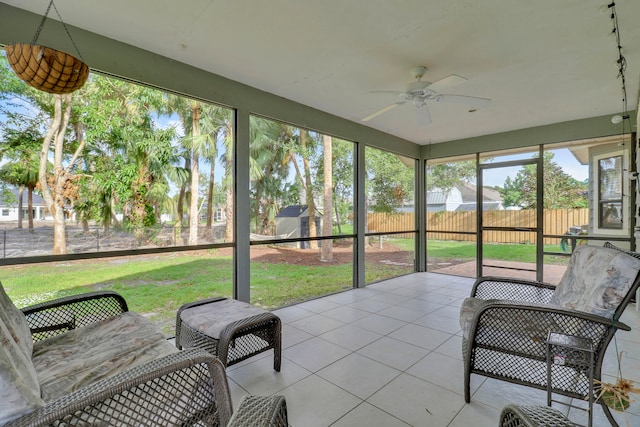 sunroom / solarium with ceiling fan