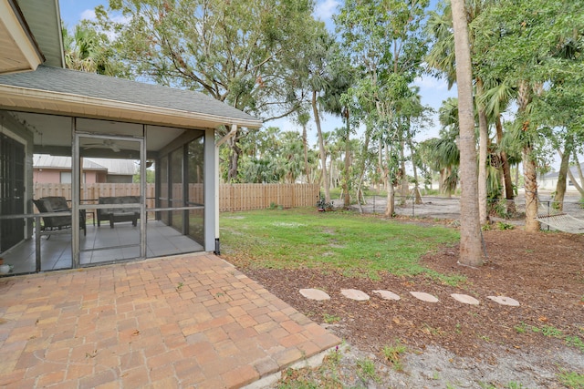 view of yard with a patio and a sunroom