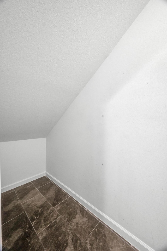 11461 SW Lyra Dr, Port Saint Lucie, FL 34987 - detailed view of a textured ceiling and baseboards