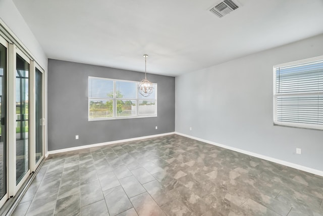 11461 SW Lyra Dr, Port Saint Lucie, FL 34987 - unfurnished room featuring a chandelier and baseboards