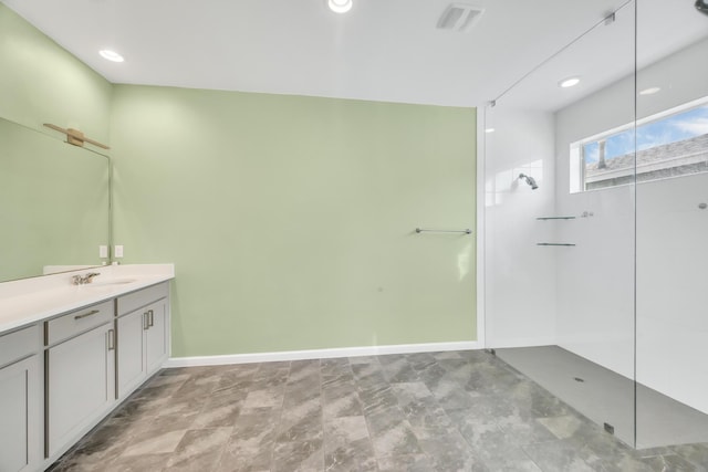 11461 SW Lyra Dr, Port Saint Lucie, FL 34987 - bathroom featuring a walk in shower, vanity, baseboards, and recessed lighting