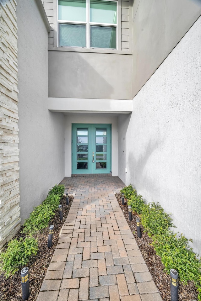 11461 SW Lyra Dr, Port Saint Lucie, FL 34987 - property entrance with french doors and stucco siding
