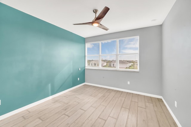 11461 SW Lyra Dr, Port Saint Lucie, FL 34987 - spare room with wood finished floors, baseboards, and a ceiling fan