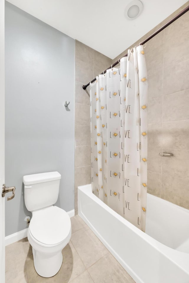 11461 SW Lyra Dr, Port Saint Lucie, FL 34987 - full bathroom featuring tile patterned floors, shower / bath combo, toilet, and baseboards