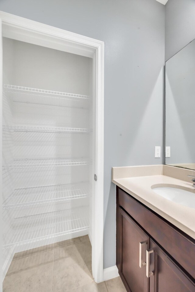11461 SW Lyra Dr, Port Saint Lucie, FL 34987 - bathroom with vanity and tile patterned floors