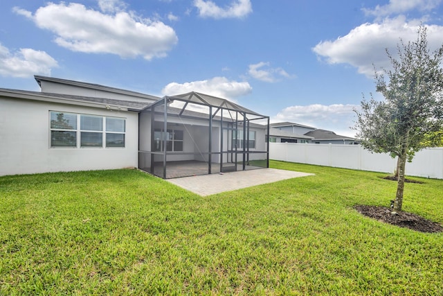 11461 SW Lyra Dr, Port Saint Lucie, FL 34987 - back of house featuring a patio area, glass enclosure, and stucco siding