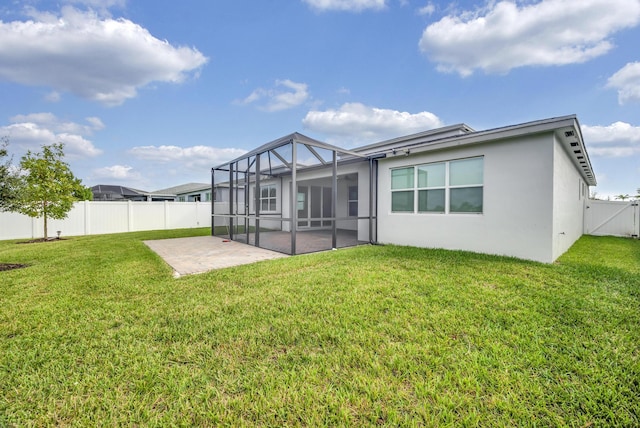 11461 SW Lyra Dr, Port Saint Lucie, FL 34987 - back of property featuring a patio area, stucco siding, and a gate