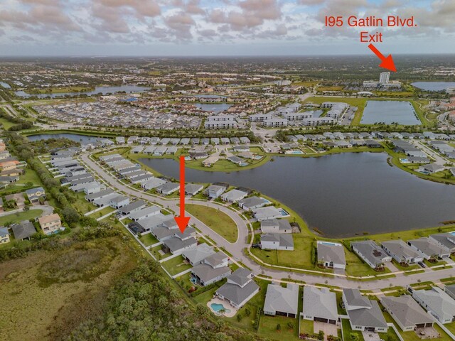 11461 SW Lyra Dr, Port Saint Lucie, FL 34987 - aerial view of property's location featuring nearby suburban area and a large body of water