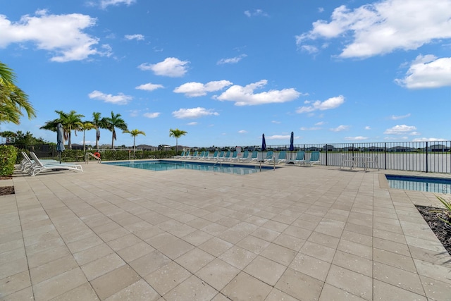 11461 SW Lyra Dr, Port Saint Lucie, FL 34987 - community pool with a patio area and fence