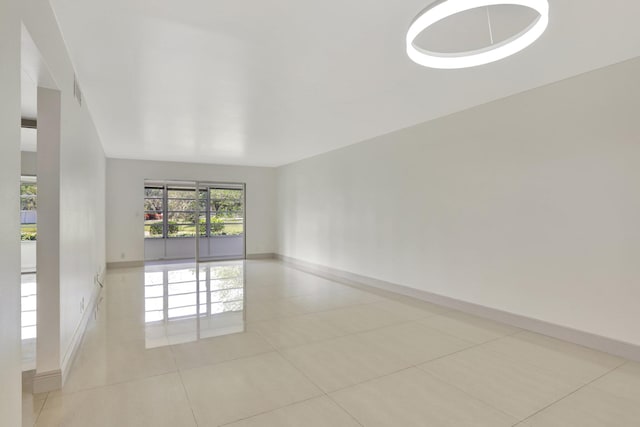 empty room with light tile patterned flooring