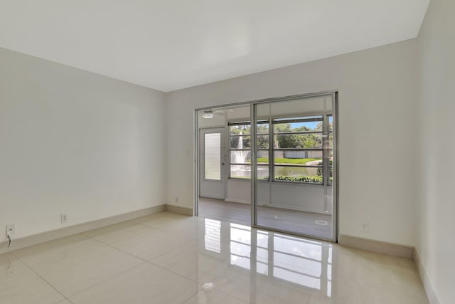 unfurnished room with light tile patterned floors