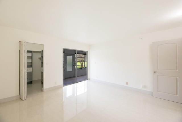 empty room with light tile patterned flooring