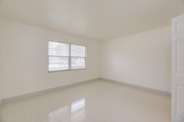 empty room with light tile patterned floors