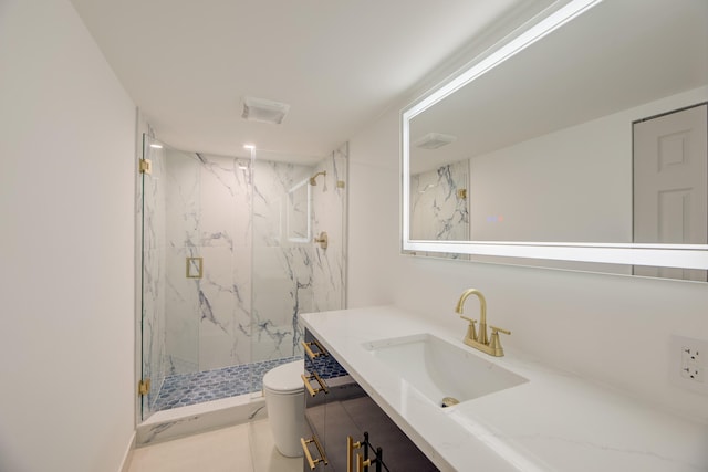 bathroom featuring toilet, vanity, and a shower with door