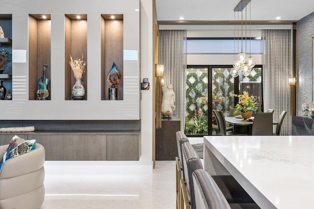 tiled dining space featuring a chandelier