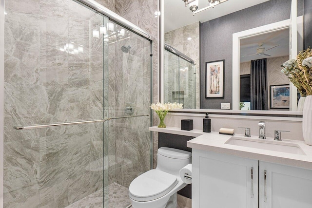 bathroom with vanity, an enclosed shower, and toilet