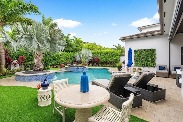 view of swimming pool featuring an in ground hot tub and a patio