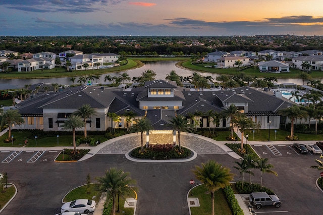 aerial view at dusk with a water view