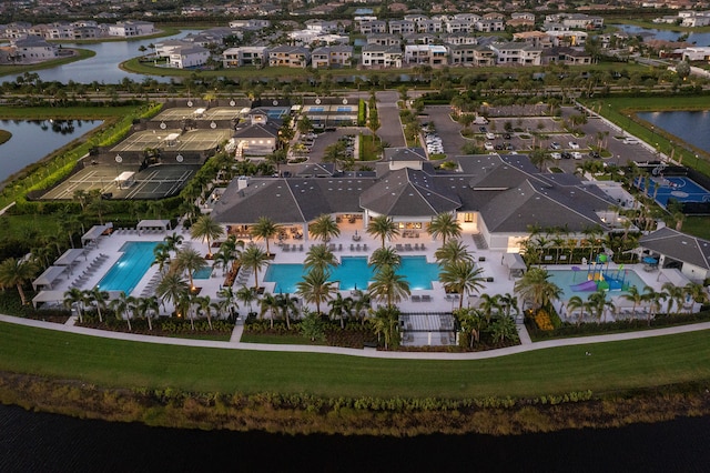 birds eye view of property with a water view