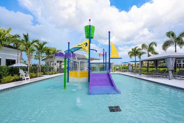 view of swimming pool with a gazebo and pool water feature