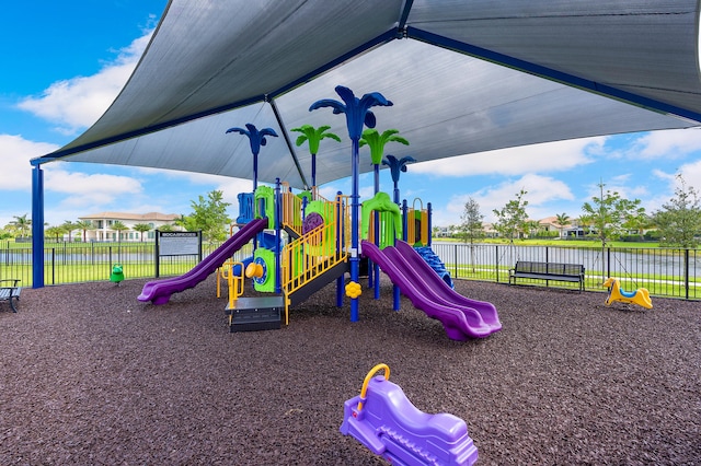 view of play area with a water view