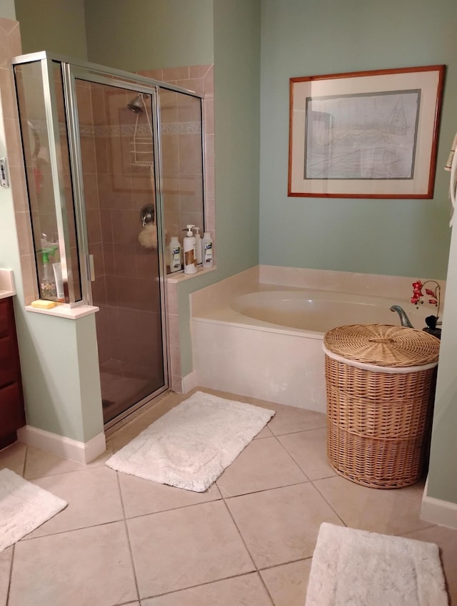 bathroom with tile patterned flooring, vanity, and independent shower and bath