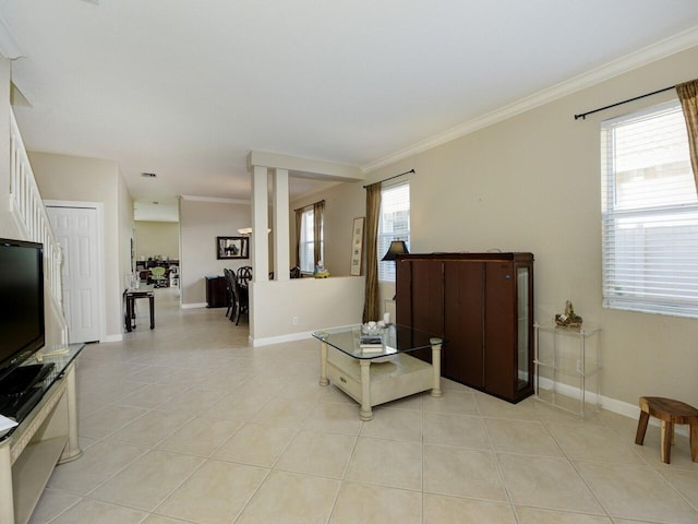 living area featuring crown molding and light tile patterned flooring