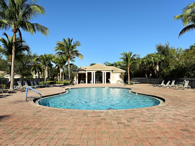 view of swimming pool with a patio area