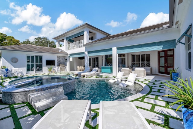 view of swimming pool with french doors, a patio, and an in ground hot tub