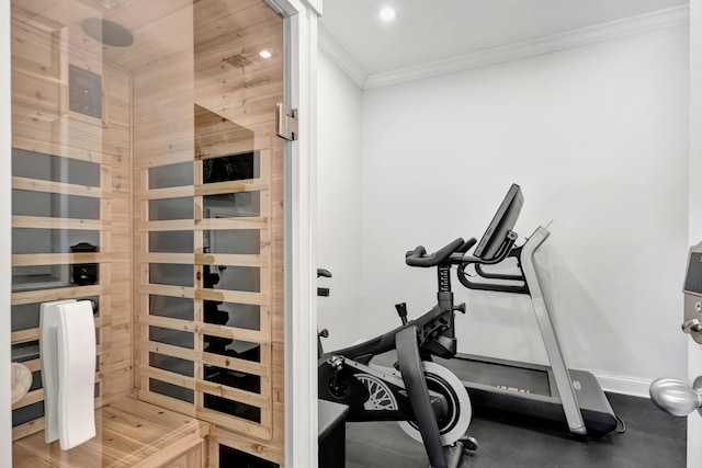 exercise room featuring ornamental molding