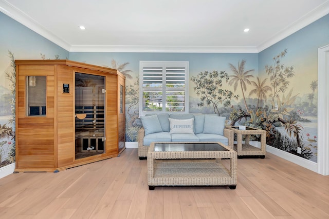 living room with light wood-type flooring and crown molding