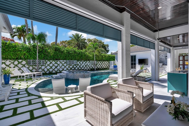 view of swimming pool with a patio area