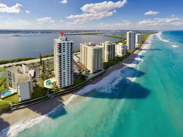 aerial view featuring a water view and a view of the beach