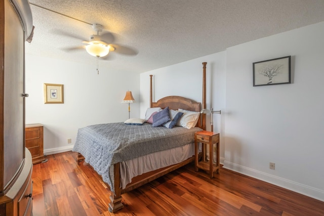 bedroom featuring ceiling fan, a textured ceiling, and hardwood / wood-style floors