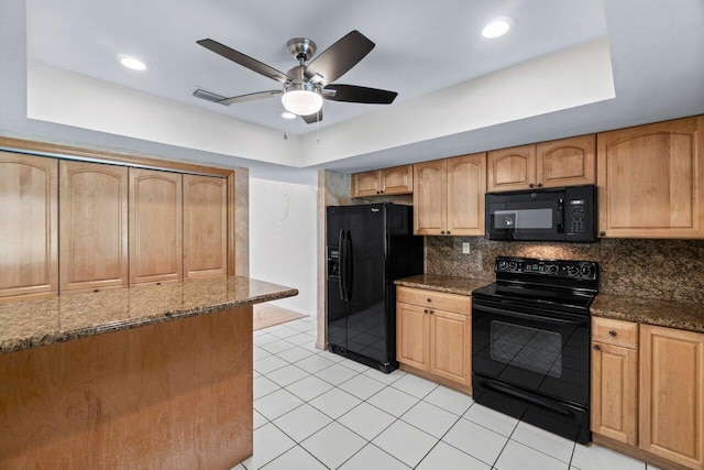 kitchen featuring tasteful backsplash, ceiling fan, dark stone counters, and black appliances