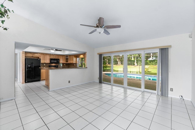 unfurnished living room featuring ceiling fan, light tile patterned flooring, and lofted ceiling