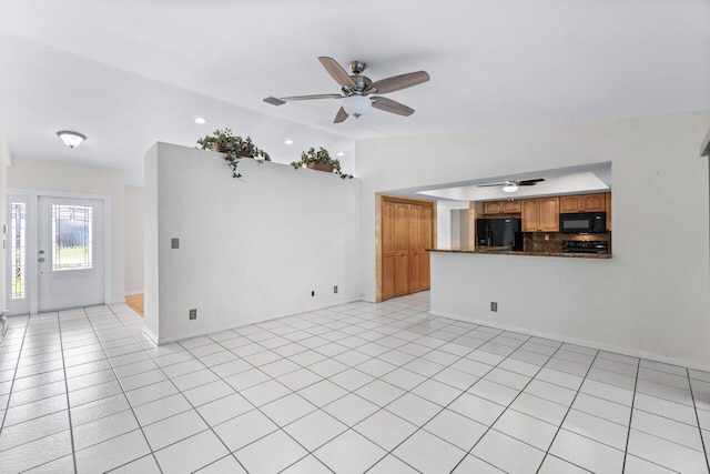 unfurnished living room featuring light tile patterned floors, ceiling fan, and lofted ceiling