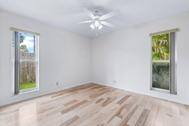 empty room featuring ceiling fan and light hardwood / wood-style floors